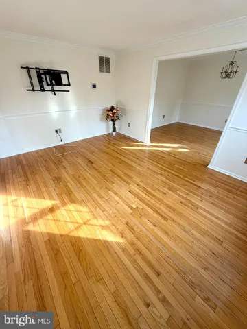 a view of deck with seating space and trees in the background