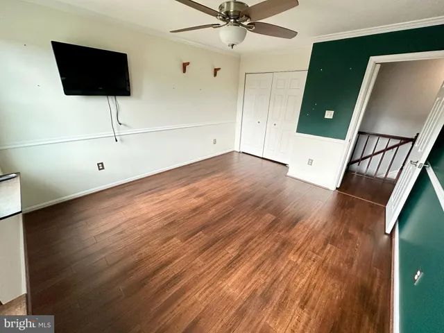 a view of an empty room with a fireplace