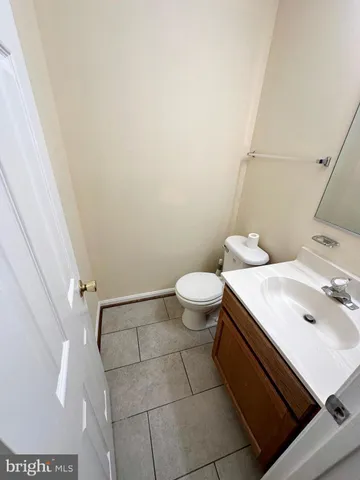 a view of deck with seating space and trees in the background