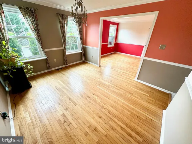 a view of front door with furniture and a window