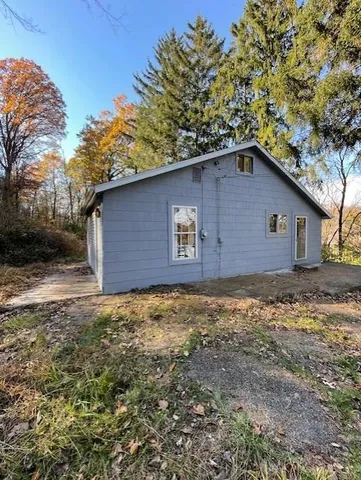 a house with trees in the background
