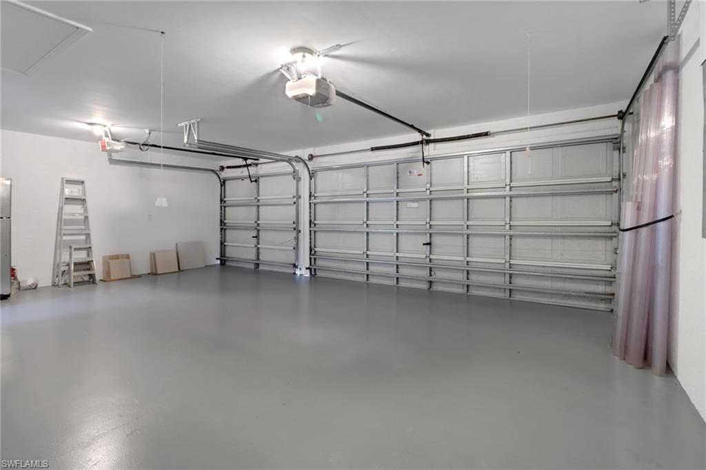 3283 Potomac Court Naples, FL 34120 - Photo 20 of 29 Garage with a garage door opener