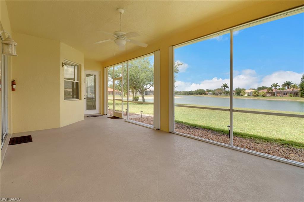 3283 Potomac Court Naples, FL 34120 - Photo 21 of 29 Unfurnished sunroom with a water view and ceiling fan