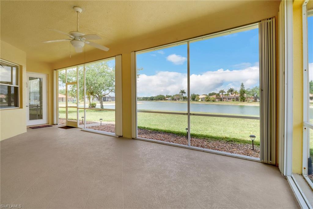 3283 Potomac Court Naples, FL 34120 - Photo 22 of 29 Unfurnished sunroom featuring a water view and ceiling fan