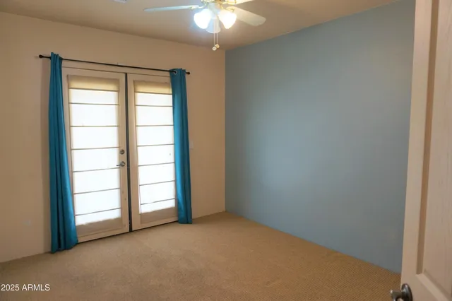 an empty room with windows and closet
