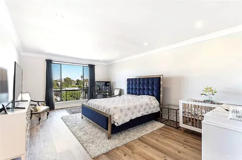 a bedroom with a bed and a dresser in it