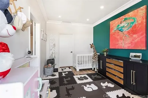 a bedroom with furniture and a rug