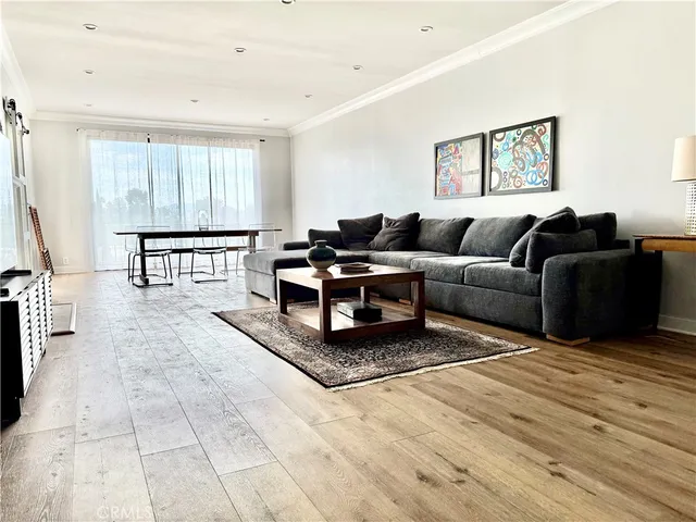 a living room with a couch and a window