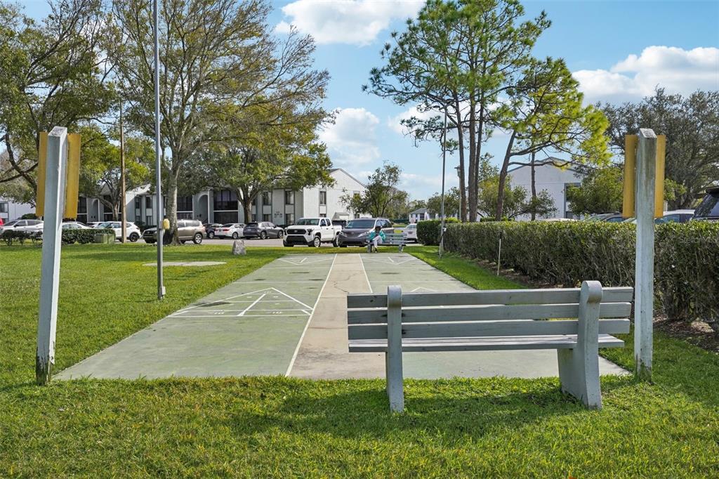 1344 Pine Ridge Circle East, Unit E3 Tarpon Springs, FL 34688 - Photo 18 of 25 a view of a park with large trees