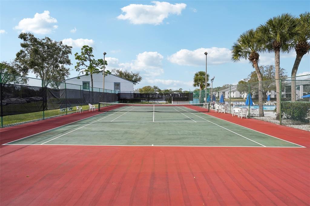 1344 Pine Ridge Circle East, Unit E3 Tarpon Springs, FL 34688 - Photo 21 of 25 a view of a volley ball court
