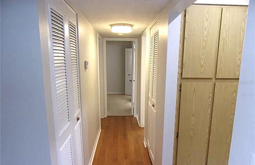 1344 Pine Ridge Circle East, Unit E3 Tarpon Springs, FL 34688 - Photo 5 of 25 a view of a bathroom from a hallway