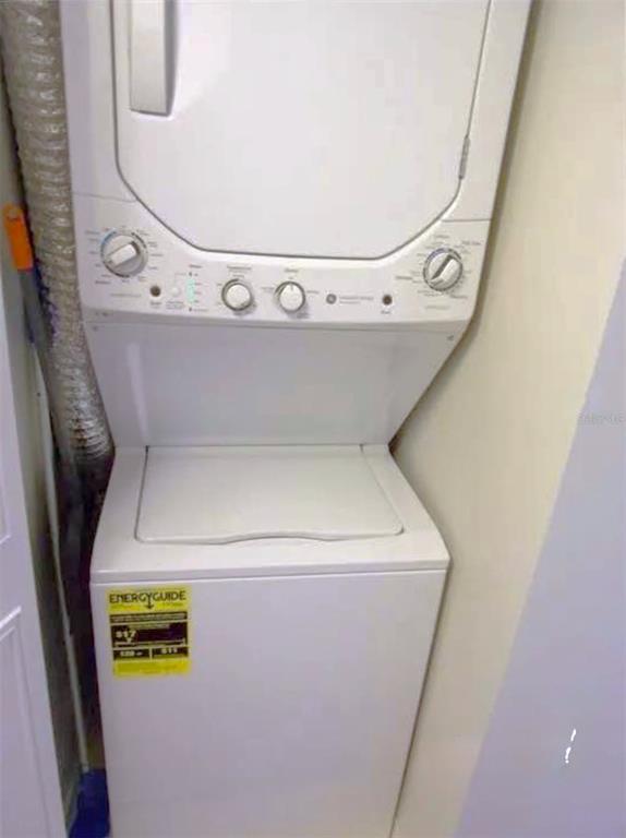 1344 Pine Ridge Circle East, Unit E3 Tarpon Springs, FL 34688 - Photo 10 of 25 a utility room with dryer and washer