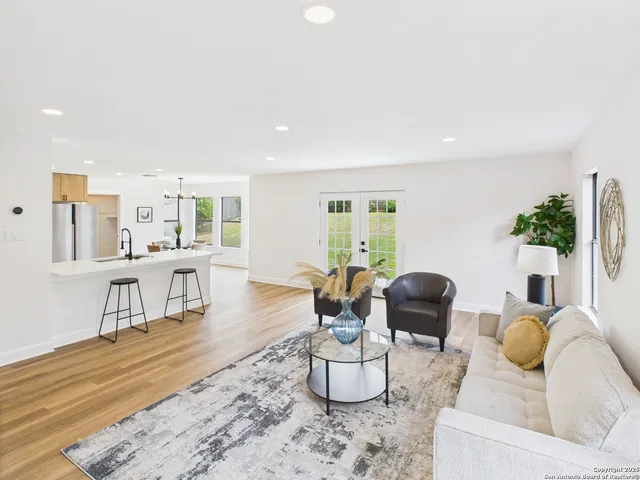 a living room with furniture and a table