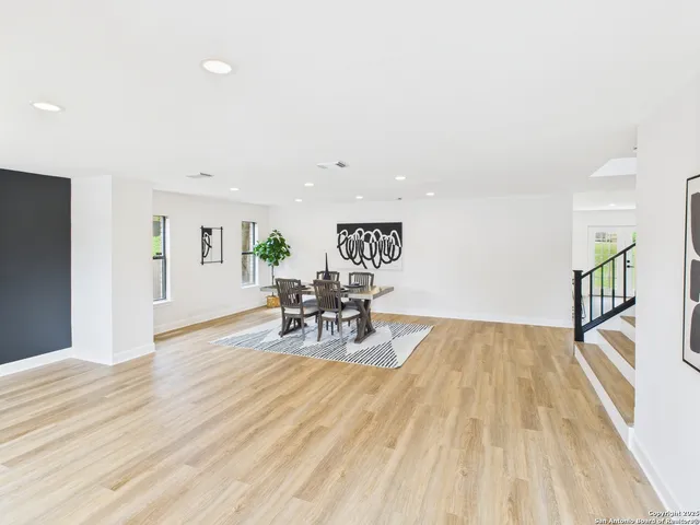 a view of a livingroom with furniture and wooden floor