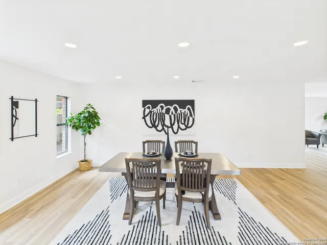 a bedroom with a bed and a table