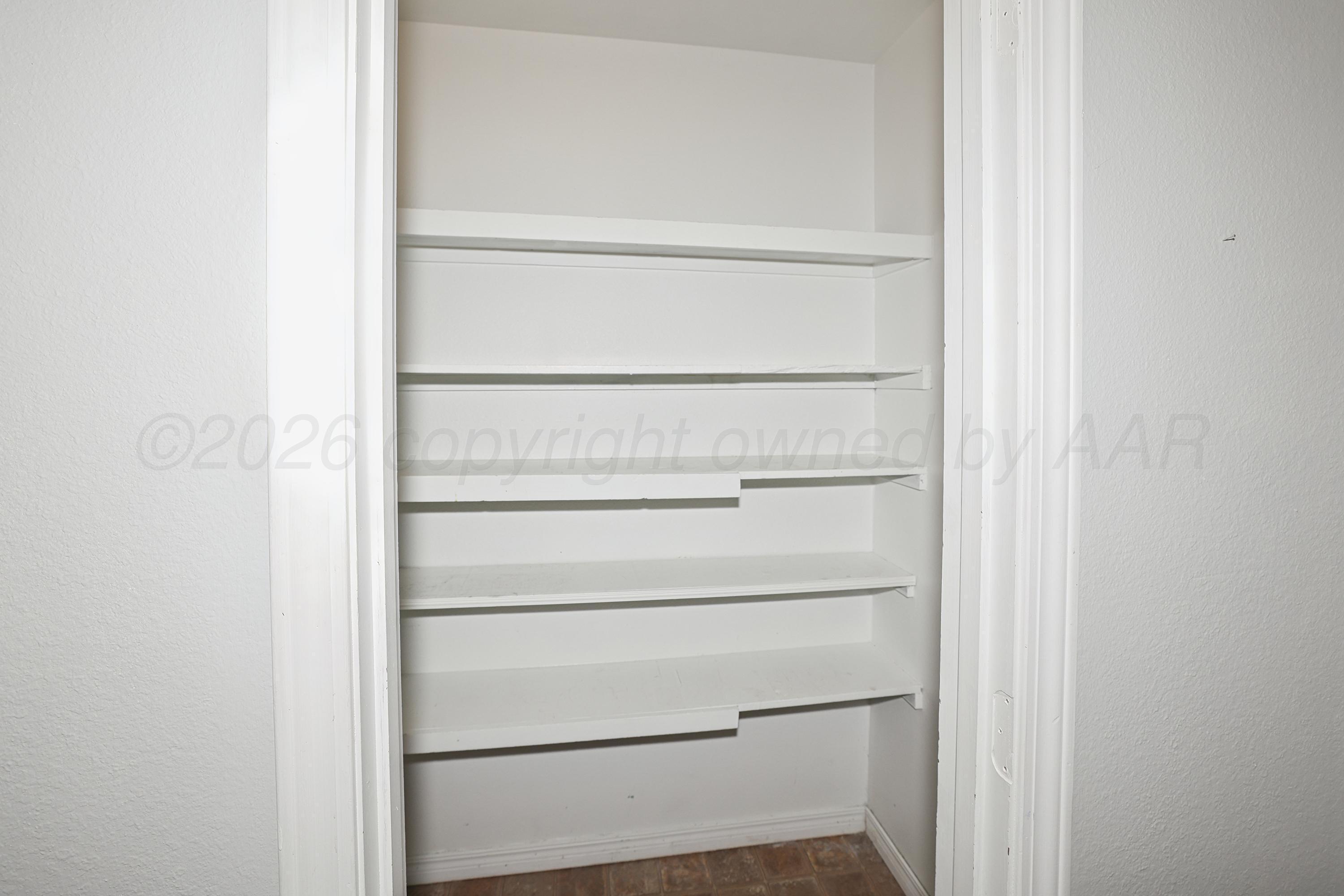 6108 Cornell Street Amarillo, TX 79109 - Photo 12 of 26 a view of walk in closet with empty racks