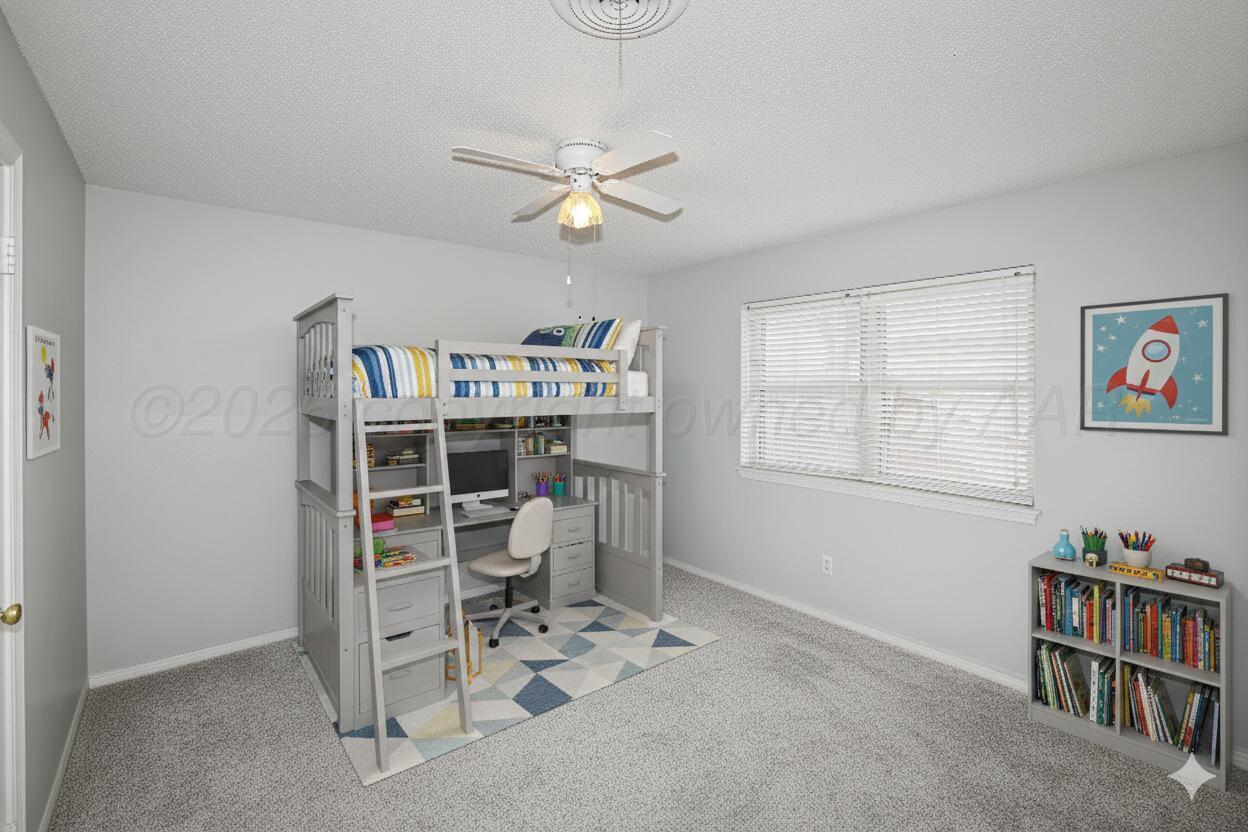 6108 Cornell Street Amarillo, TX 79109 - Photo 20 of 26 a view of a workspace with furniture and a bookshelf