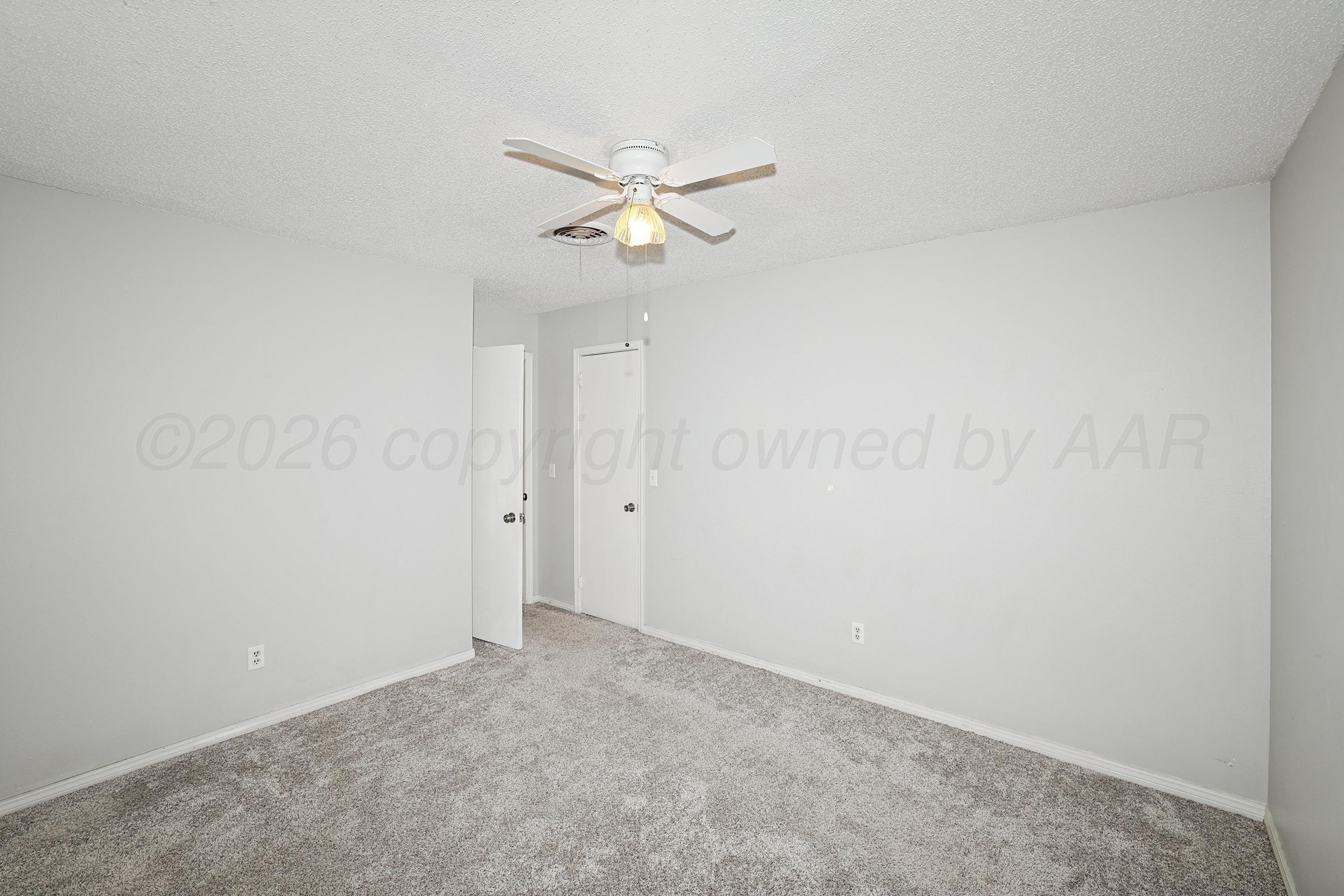 6108 Cornell Street Amarillo, TX 79109 - Photo 21 of 26 a view of a ceiling fan in a bathroom