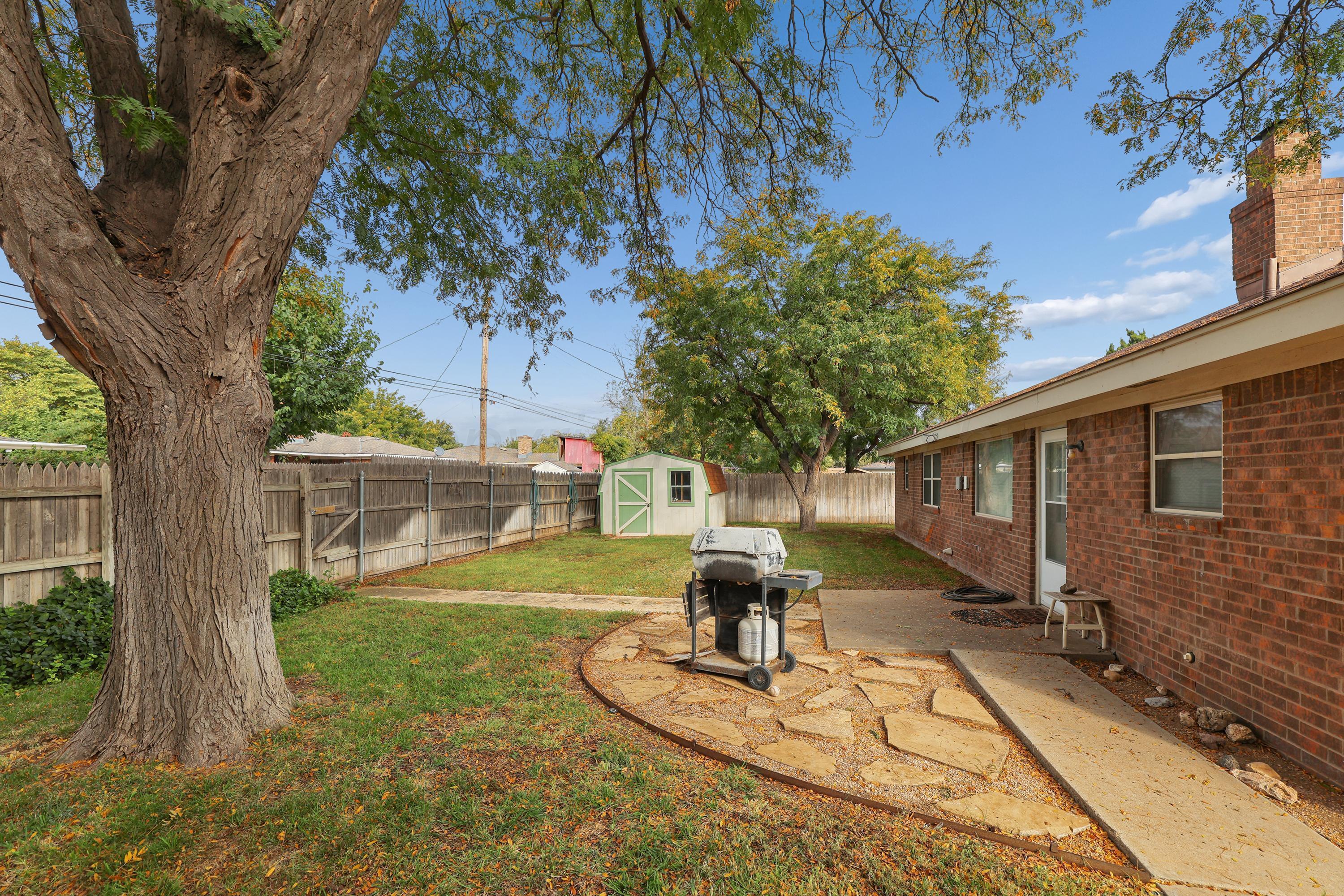 6108 Cornell Street Amarillo, TX 79109 - Photo 23 of 26 a front view of a house with garden