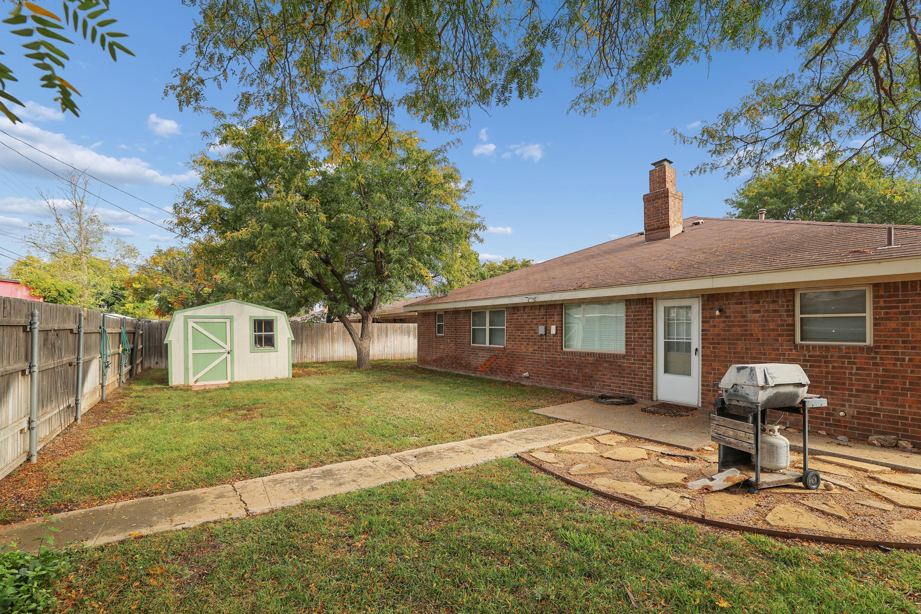 6108 Cornell Street Amarillo, TX 79109 - Photo 24 of 26 a front view of house with yard outdoor seating and barbeque oven