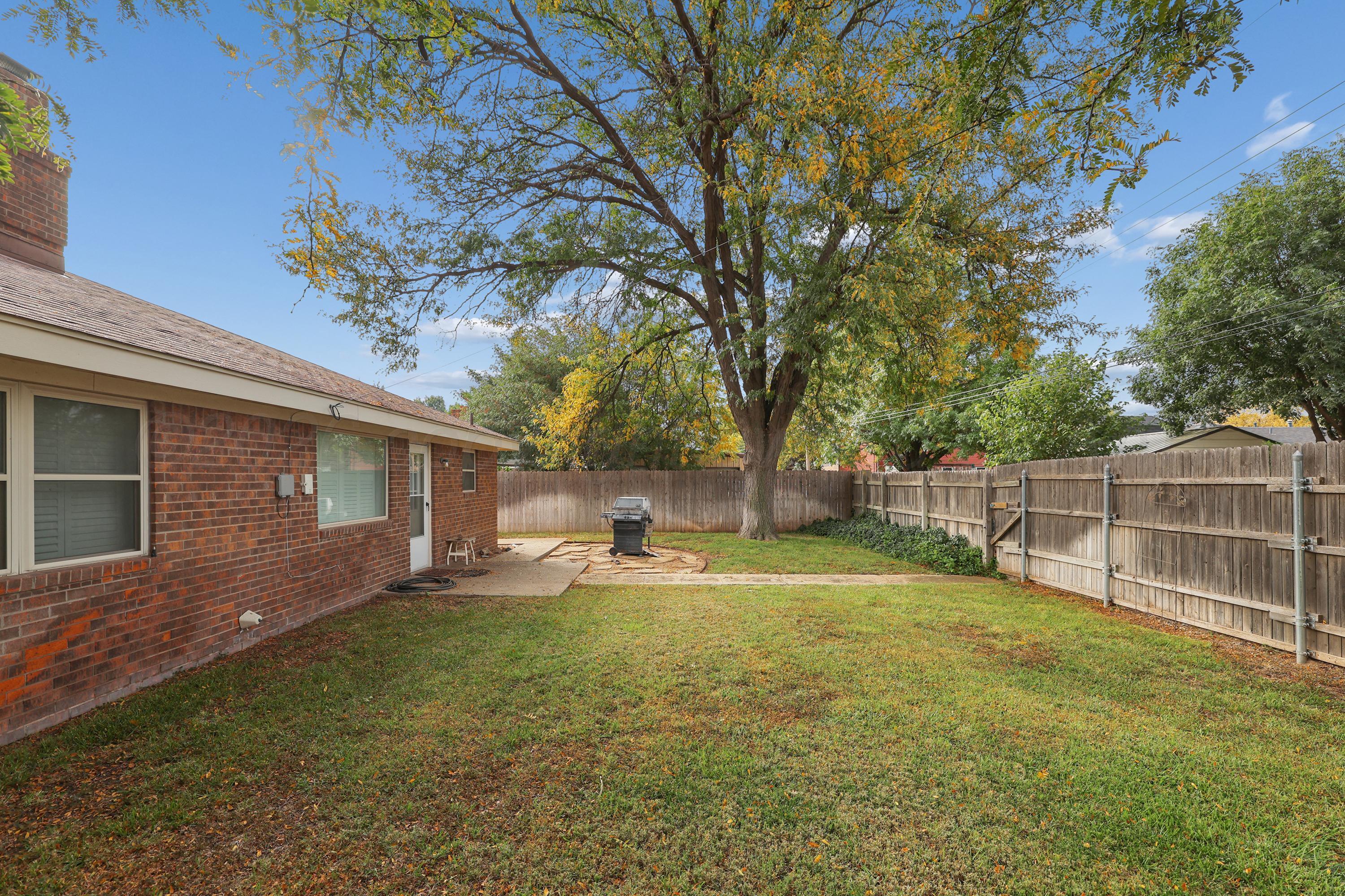 6108 Cornell Street Amarillo, TX 79109 - Photo 25 of 26 a backyard of a house with barbeque oven