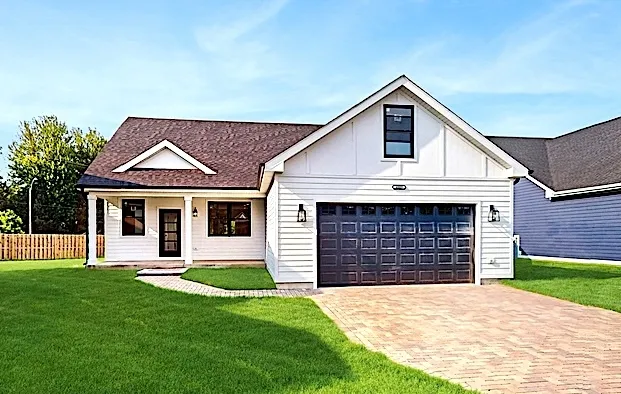 a front view of a house with a yard