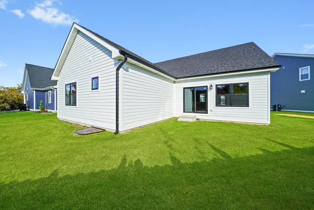 a view of a backyard of the house