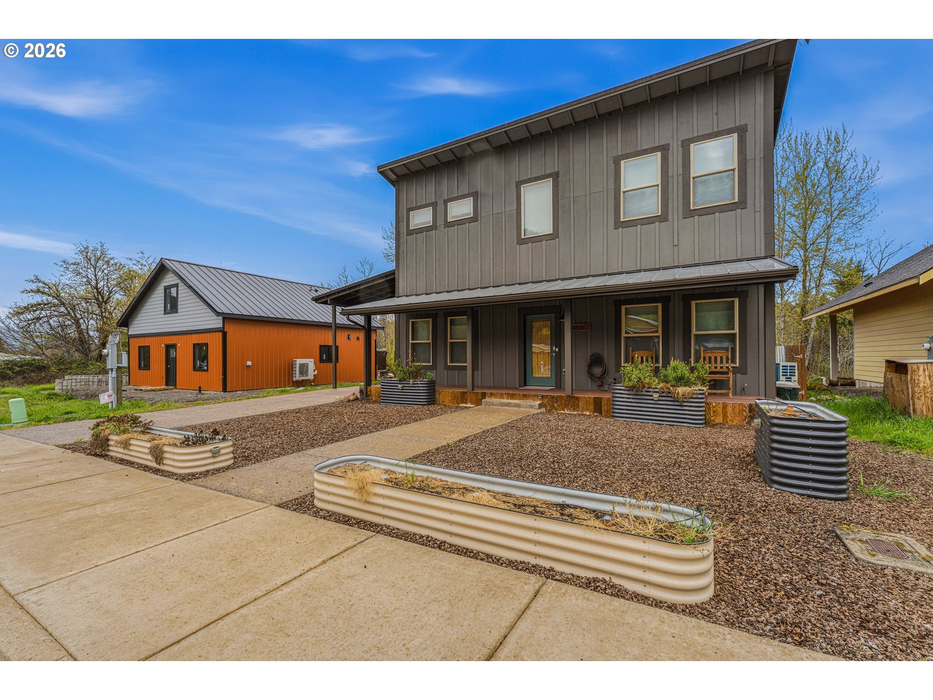 48367 Roaring Rapids Way Oakridge, OR 97463 - Photo 1 of 23 a front view of a house with a yard