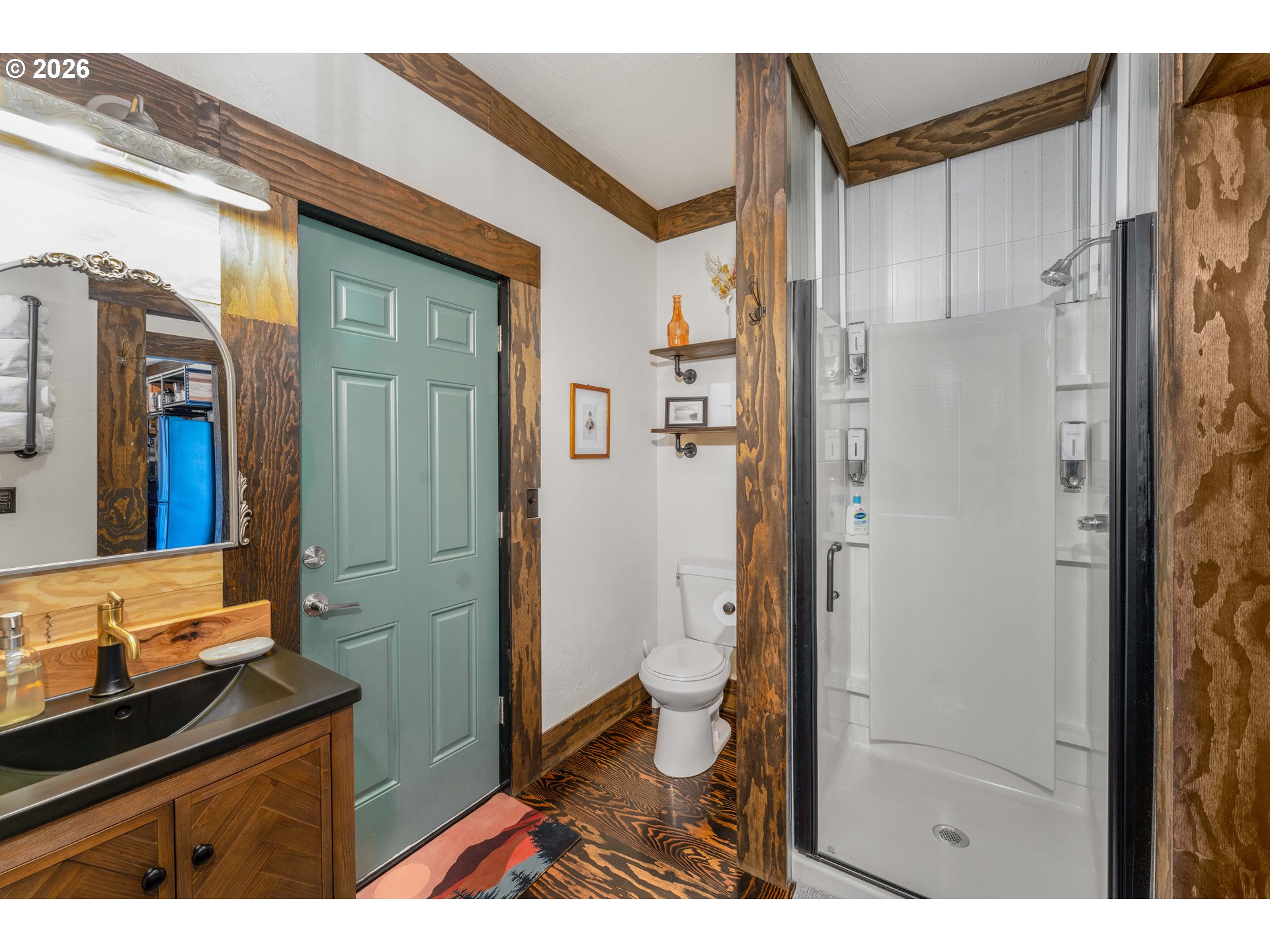 48367 Roaring Rapids Way Oakridge, OR 97463 - Photo 11 of 23 a bathroom with a sink a toilet a shower and a mirror