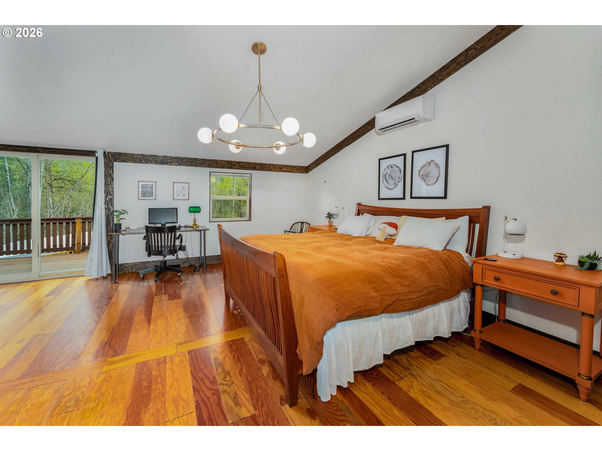 48367 Roaring Rapids Way Oakridge, OR 97463 - Photo 14 of 23 a spacious bedroom with a bed and a chandelier