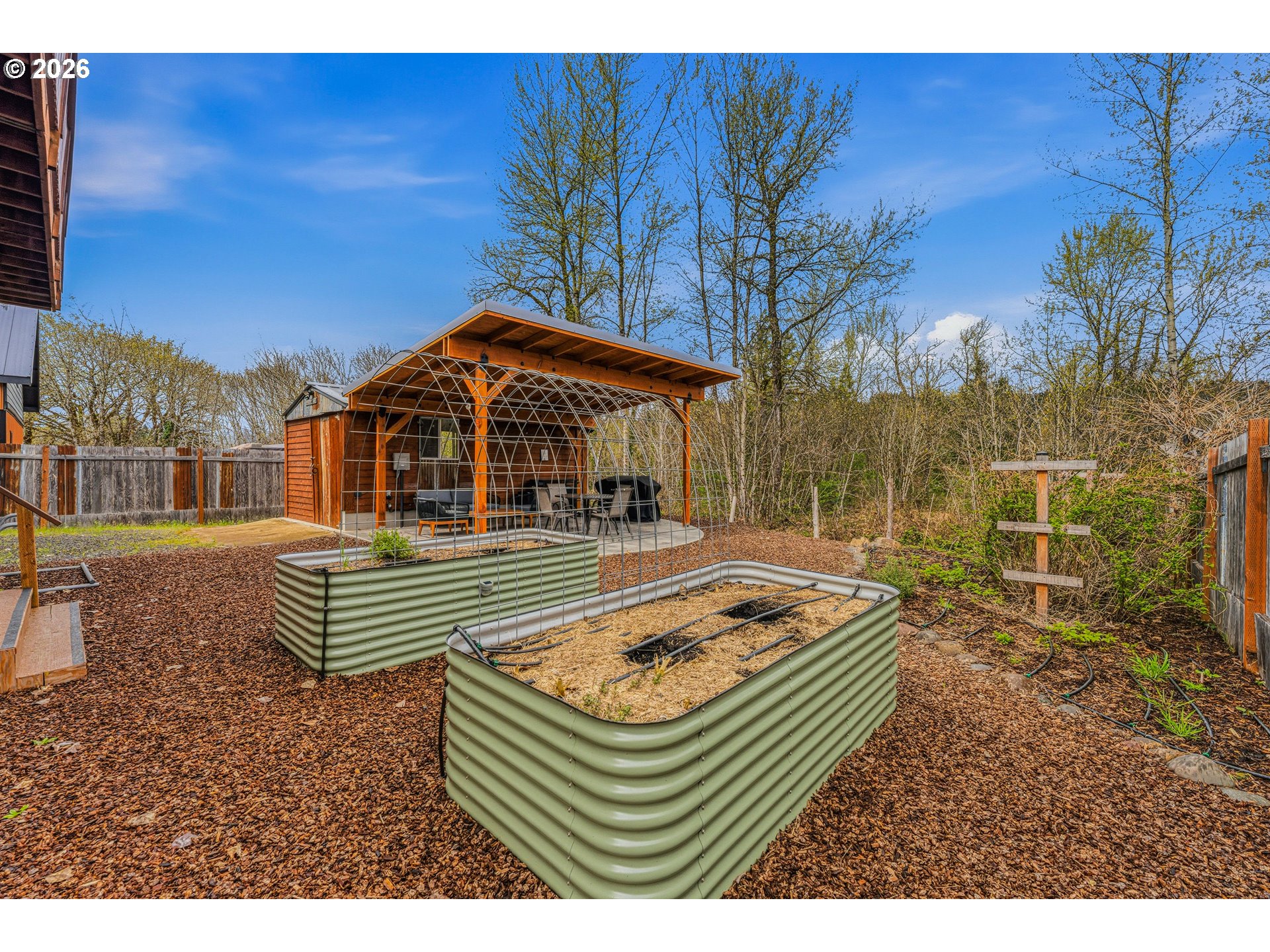 48367 Roaring Rapids Way Oakridge, OR 97463 - Photo 19 of 23 a front view of a house with garden