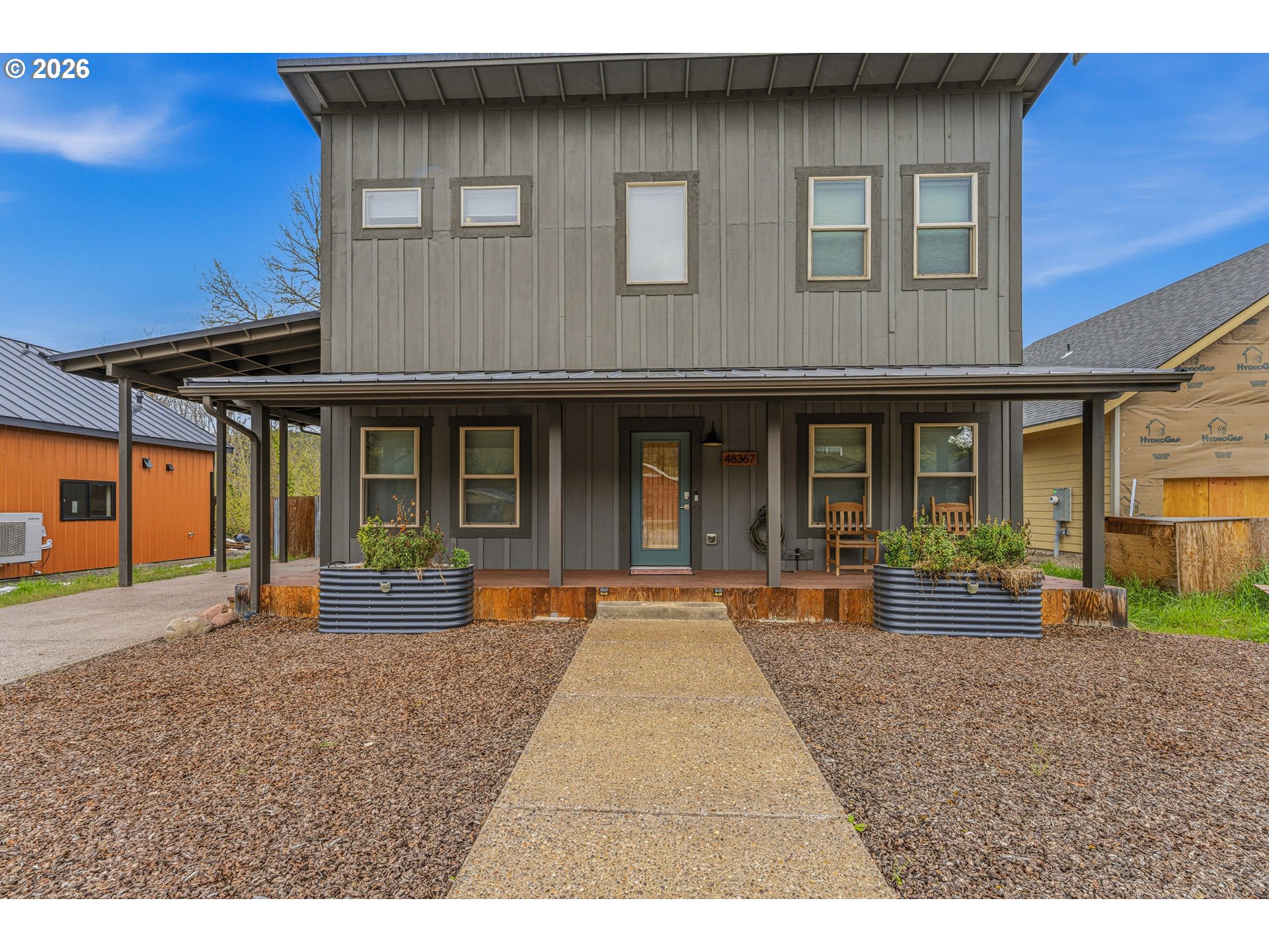 48367 Roaring Rapids Way Oakridge, OR 97463 - Photo 2 of 23 a view of a house with a patio