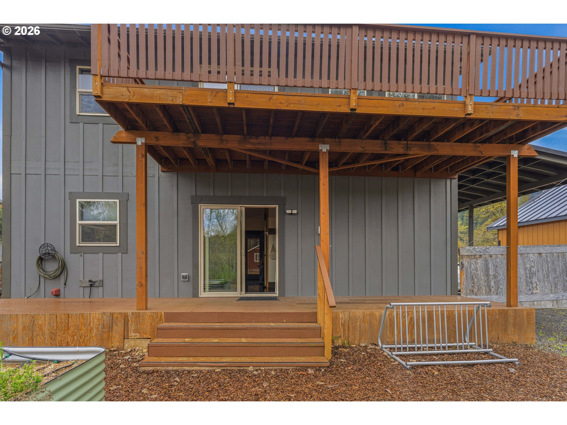 48367 Roaring Rapids Way Oakridge, OR 97463 - Photo 22 of 23 a view of a patio with table and chairs