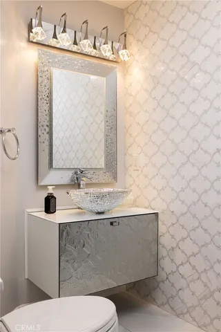 a view of a living room kitchen and a large window