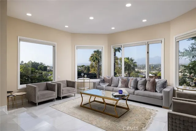 a bedroom with a bed and a flat screen television