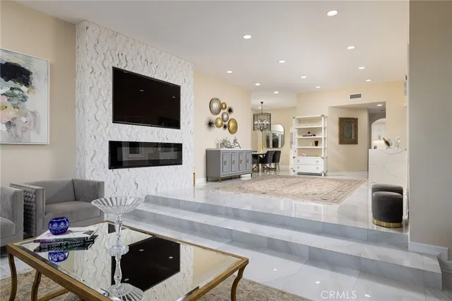 a bathroom with a granite countertop toilet sink and mirror
