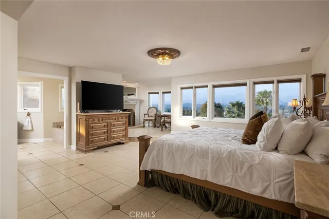 a bedroom with a bed and a couch