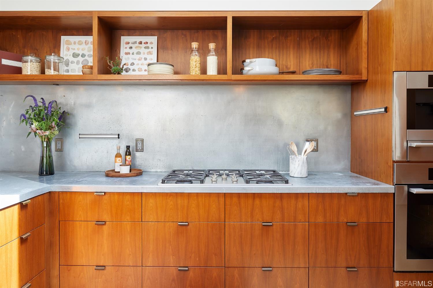 2440 Broadway San Francisco, CA 94115 - Photo 11 of 39 a kitchen with granite countertop a sink a stove and cabinets