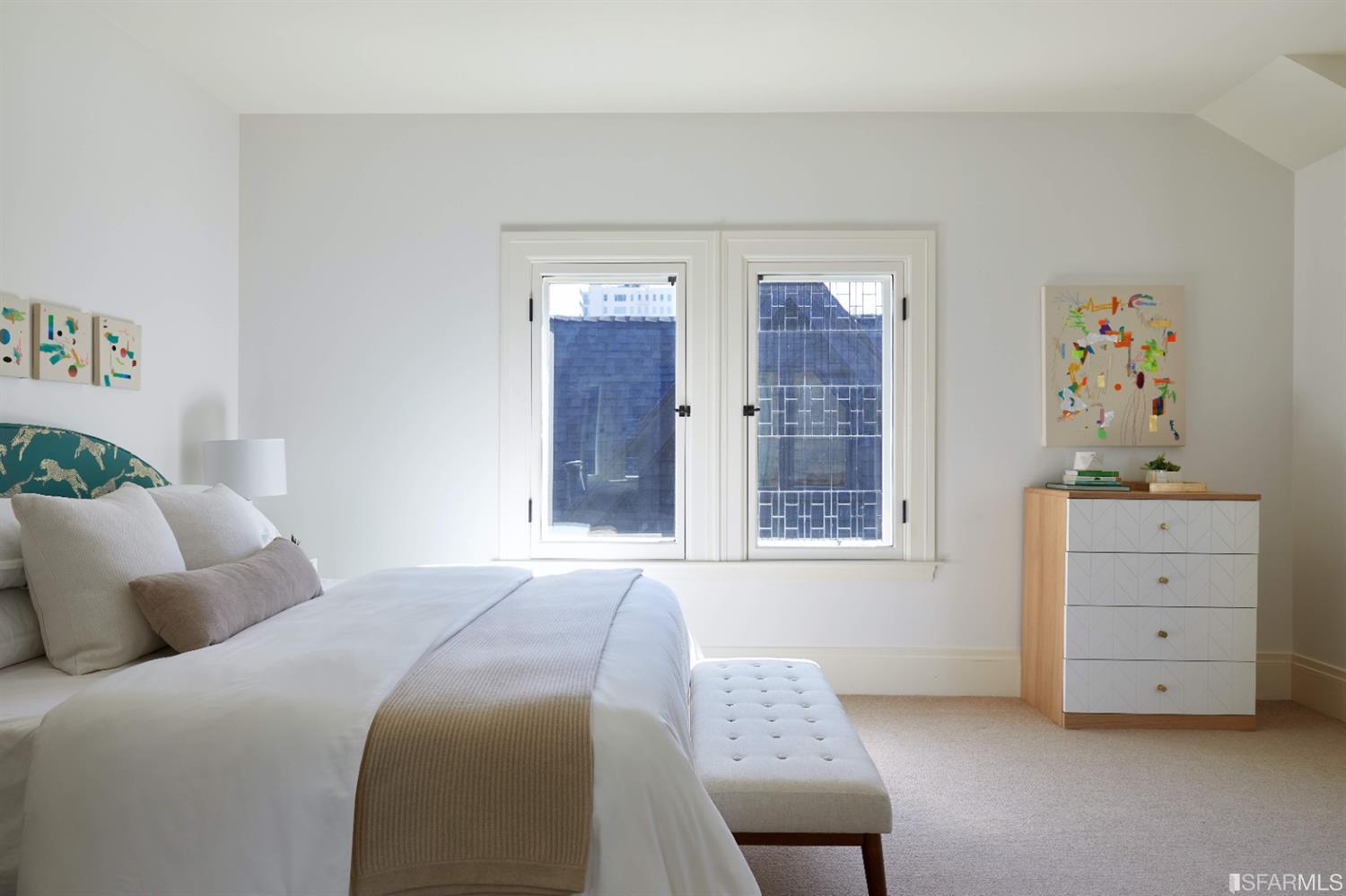 2440 Broadway San Francisco, CA 94115 - Photo 16 of 39 a bedroom with a bed and a window