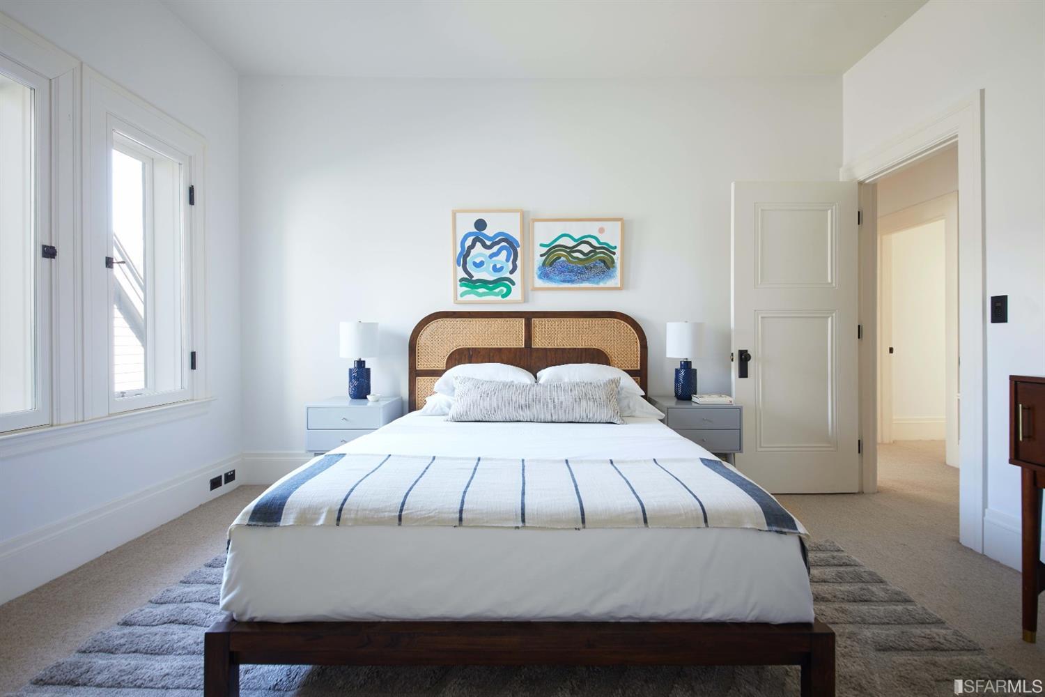 2440 Broadway San Francisco, CA 94115 - Photo 24 of 39 a bedroom with a bed and a window with wooden floor