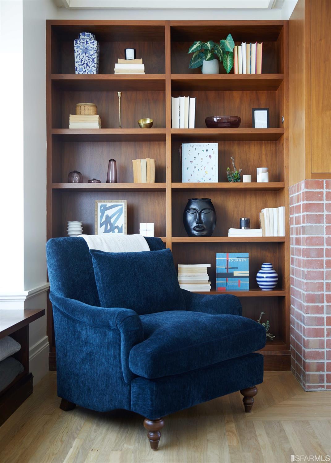 2440 Broadway San Francisco, CA 94115 - Photo 6 of 39 a living room with furniture and a book shelf