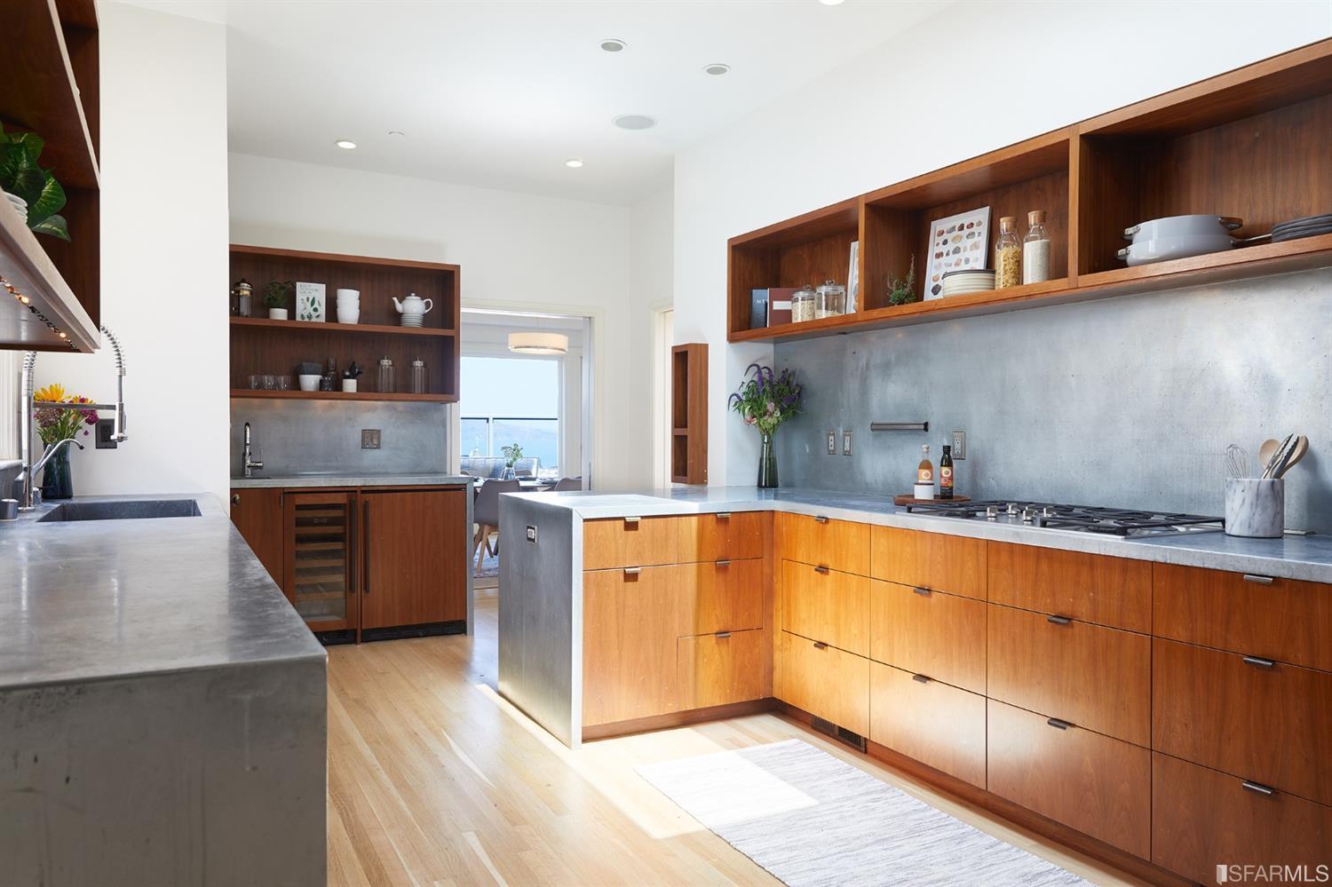 2440 Broadway San Francisco, CA 94115 - Photo 10 of 39 a kitchen with stainless steel appliances granite countertop a stove a sink and a refrigerator