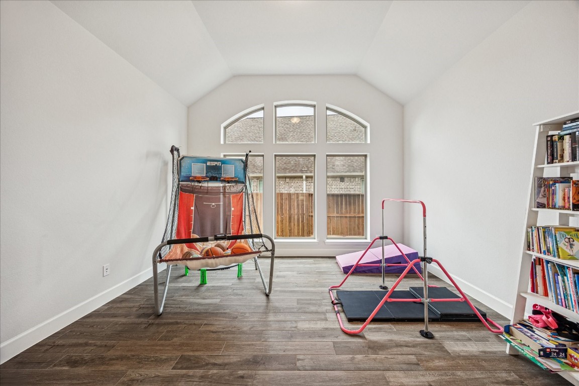 4527 Peloton Road Rosharon, TX 77583 - Photo 26 of 30 a room with gym equipment and a window