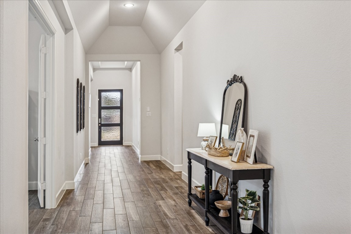 4527 Peloton Road Rosharon, TX 77583 - Photo 9 of 30 a view of a room with wooden floor furniture and windows