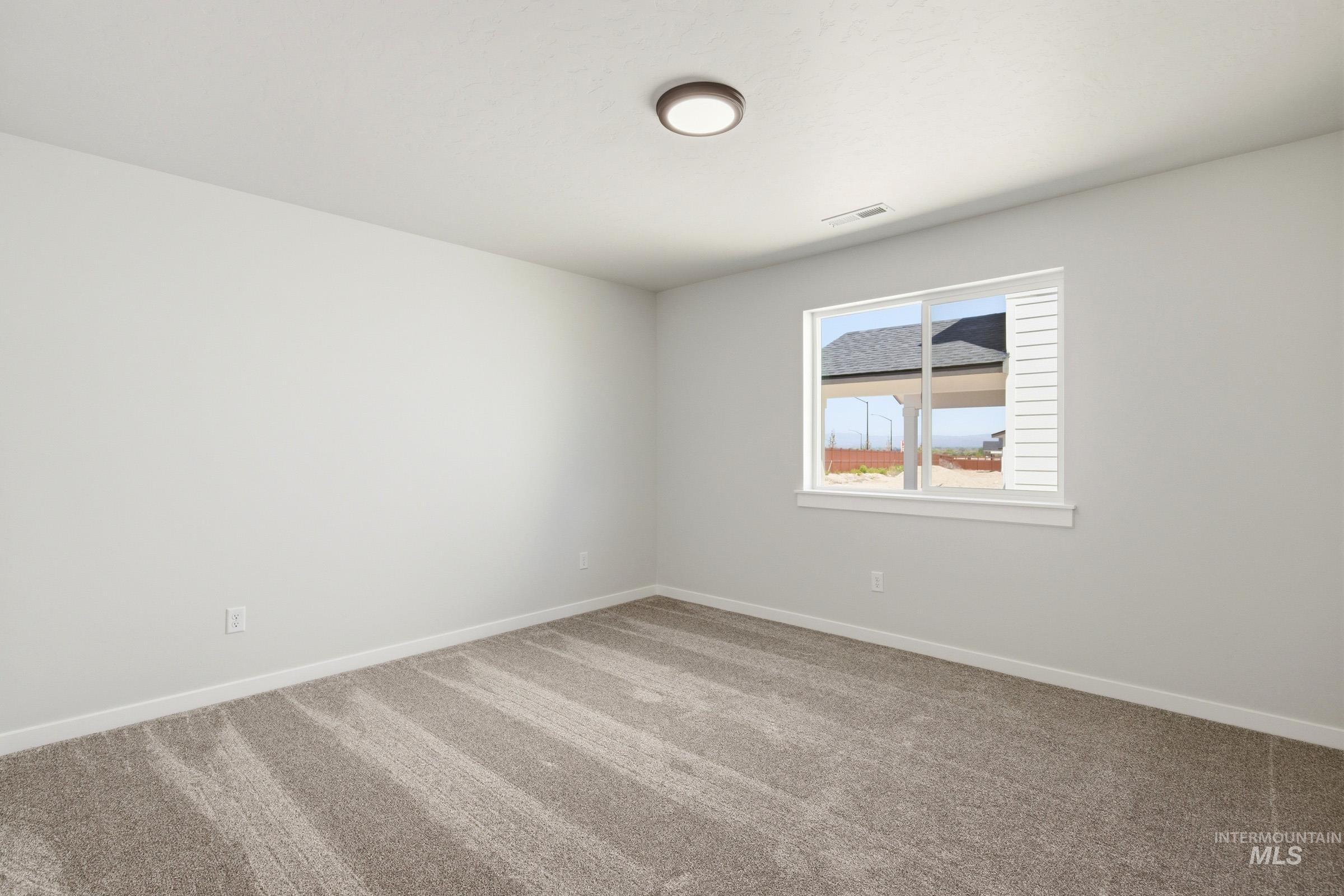 1184 West Jasper Street Meridian, ID 83642 - Photo 14 of 18 Carpeted room with a double-hung window featuring white trim and blinds