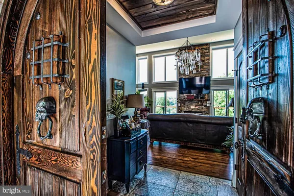 a living room with fireplace furniture and a window