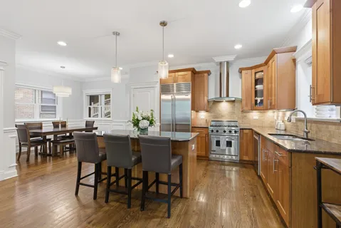 a kitchen with lots of counter top space and dining table