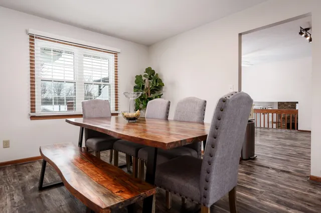 a kitchen with stainless steel appliances granite countertop a refrigerator a stove and a sink