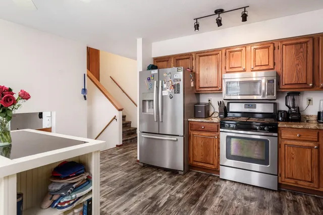 a living room with furniture a clock and a window
