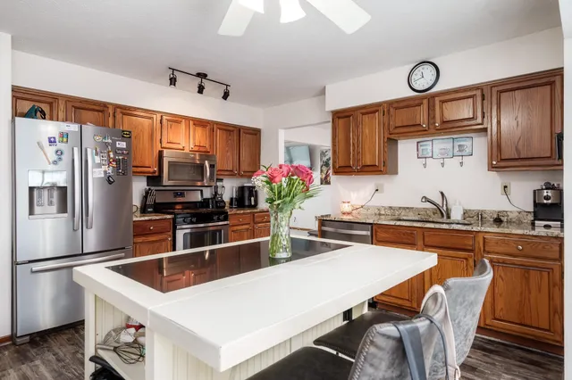 a view of a livingroom with furniture and stairs